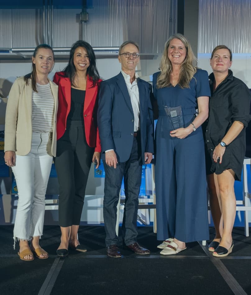 several people standing with Josh Bersin holding an award